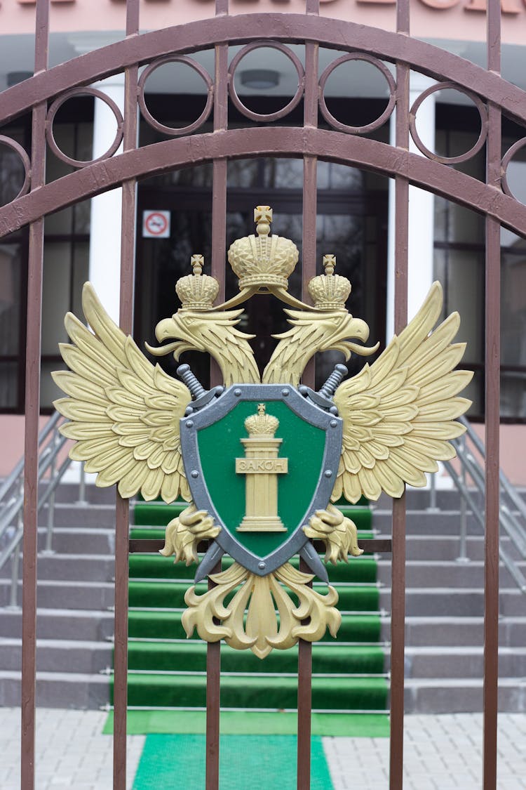 Gold Logo Mounted On A Grill 