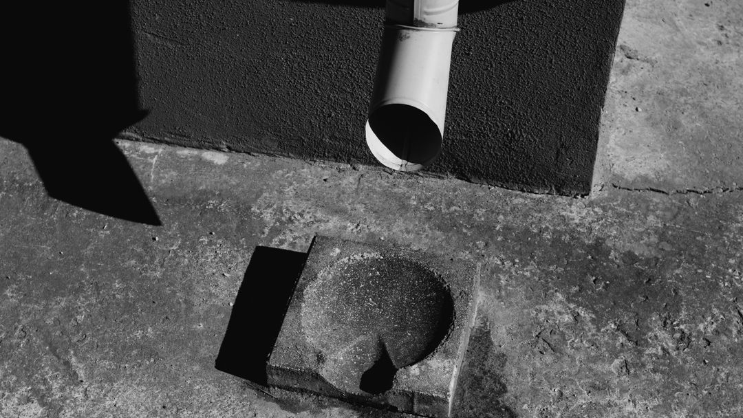 A poured apron at the waterline. What runs under it down to the dock is rarely recorded anywhere.