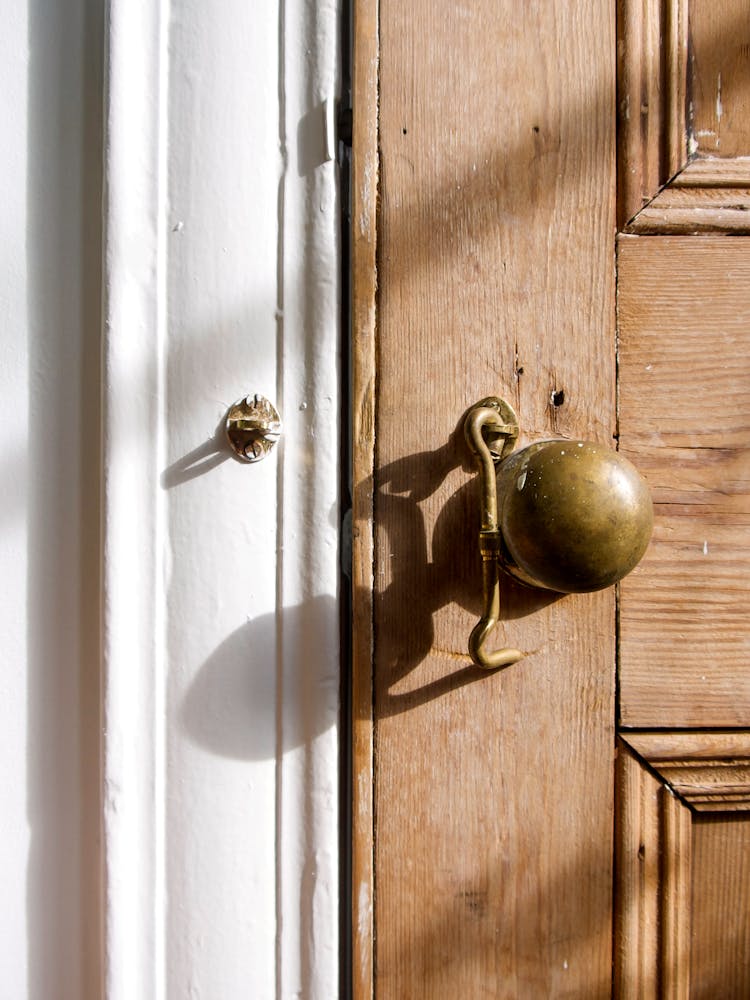 Brass Door Knob On Wooden Door