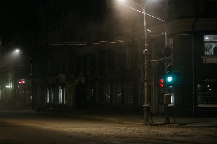 Traffic Light On An Empty Street At Night