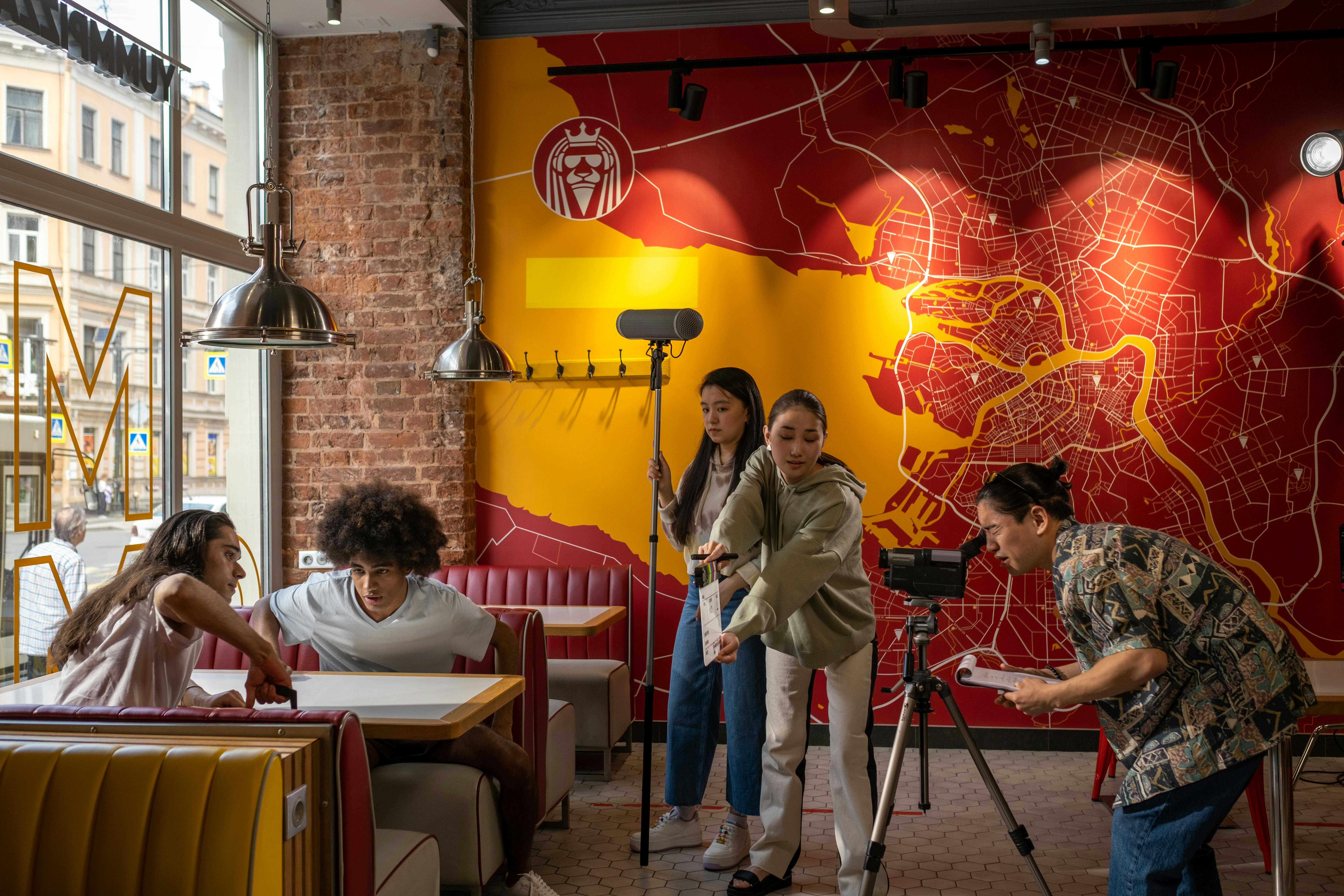 Free People Recording in a Restaurant Stock Photo