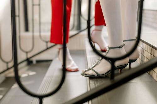 Feet in High Heels on Stairs