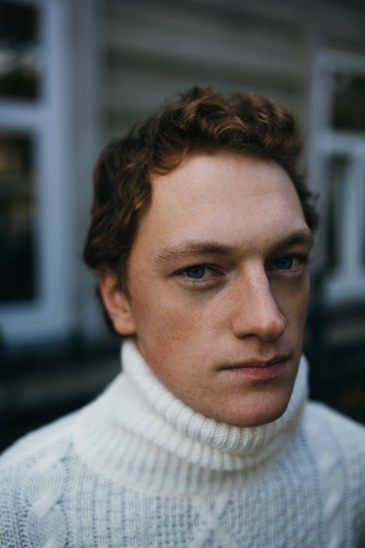 Portrait Of Black Hair Man In White Sweater