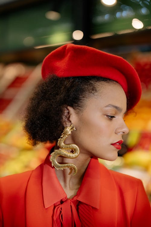 Woman in Red Beret Wearing Gold Earring