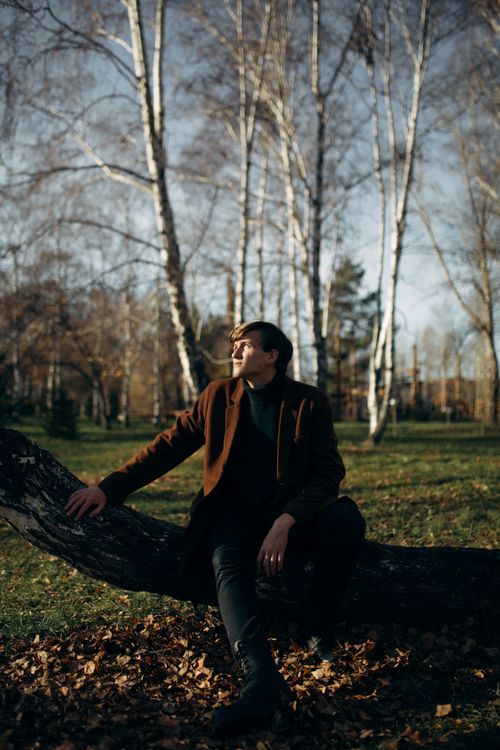 Man Relaxing with Guitar in Autumn Park · Free Stock Photo