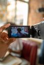A selective focus on analog camera shooting a scene 