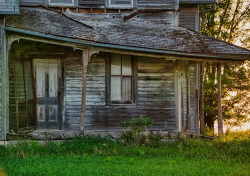 Brown Wooden House on Green Grass Field