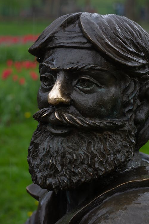 Black Concrete Statue in Close-Up Photography