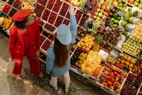 Free Women Buying Fruits in Grocery Market Stock Photo