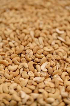 Detailed view of a heap of cashew nuts. Perfect for food and snack photography.