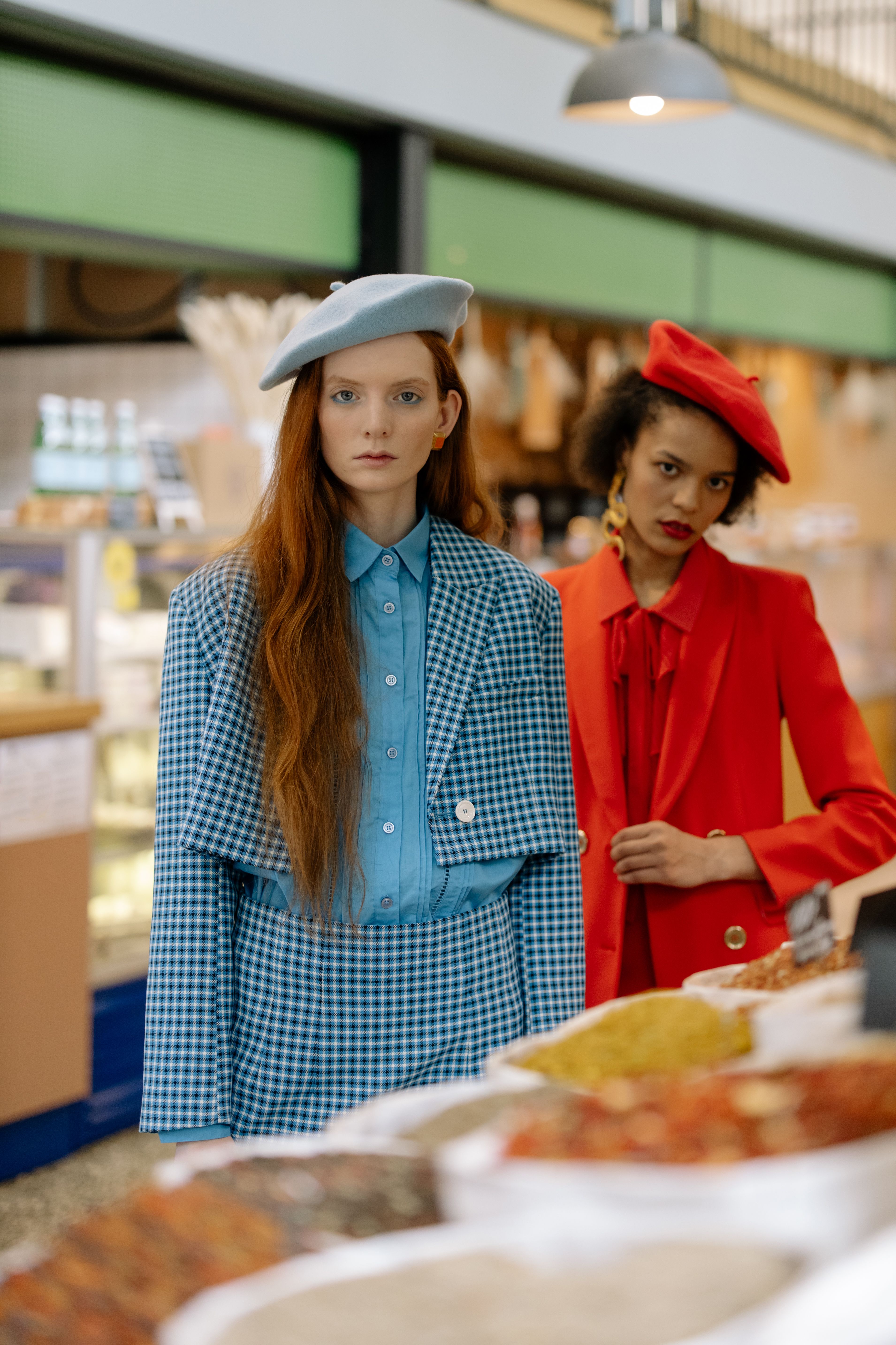 Photo of Women Wearing Red and Blue Beret Hats · Free Stock Photo