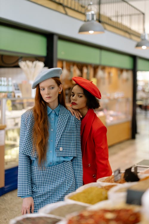 Free Women in Beret Hats Standing Inside the Grocery Stock Photo
