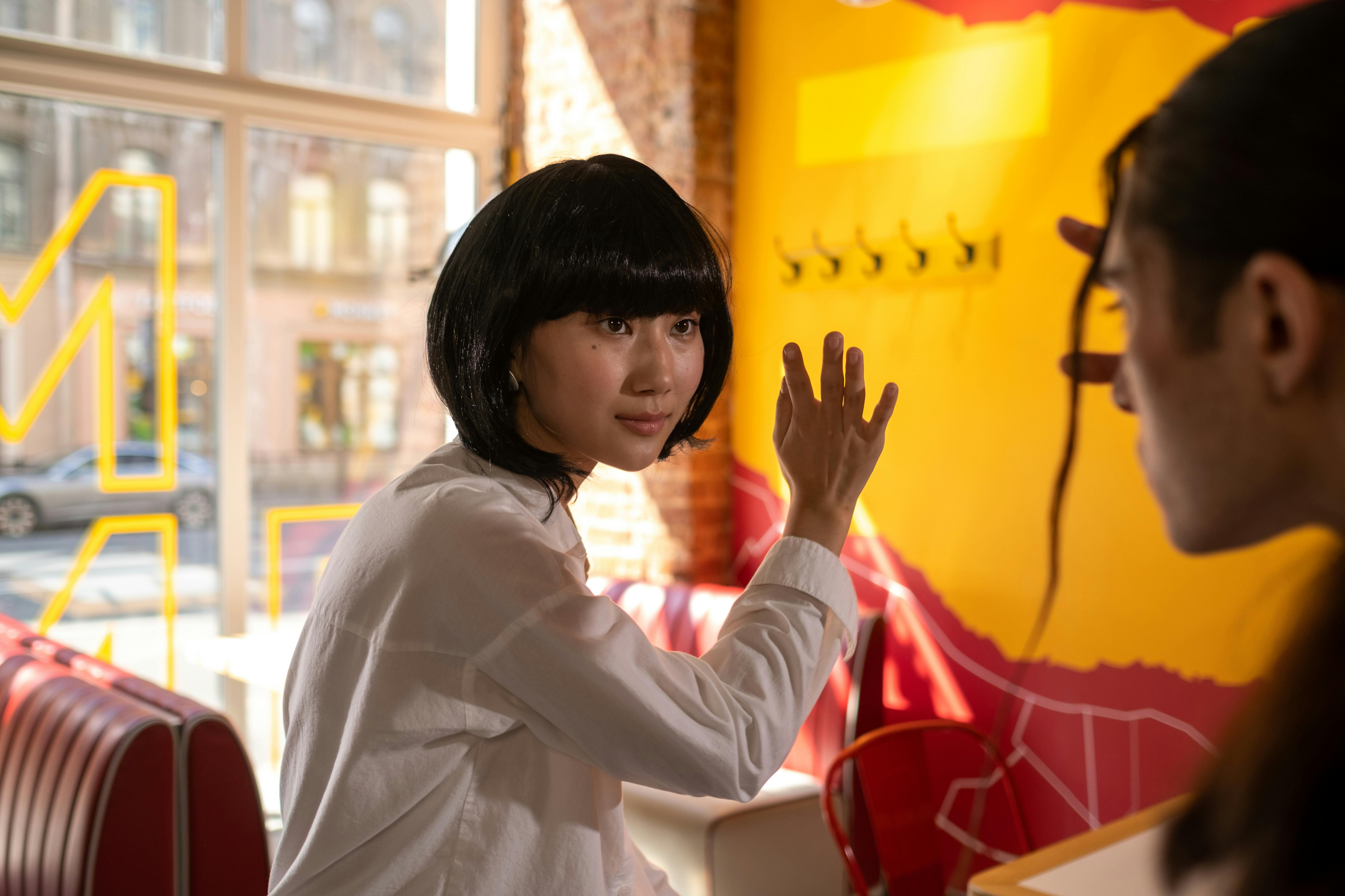 Free Photograph of a Woman with Bangs Wearing a White Shirt Stock Photo