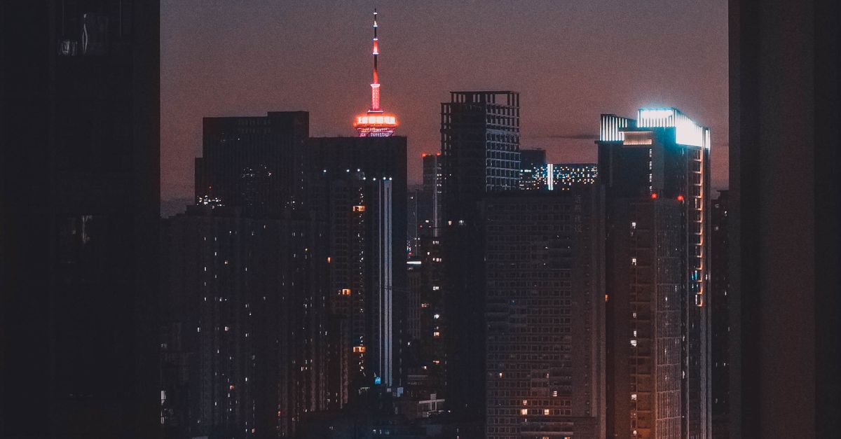 High Rise Night. View Window View of High Rise Buildings During Night Time · Free Stock Photo
