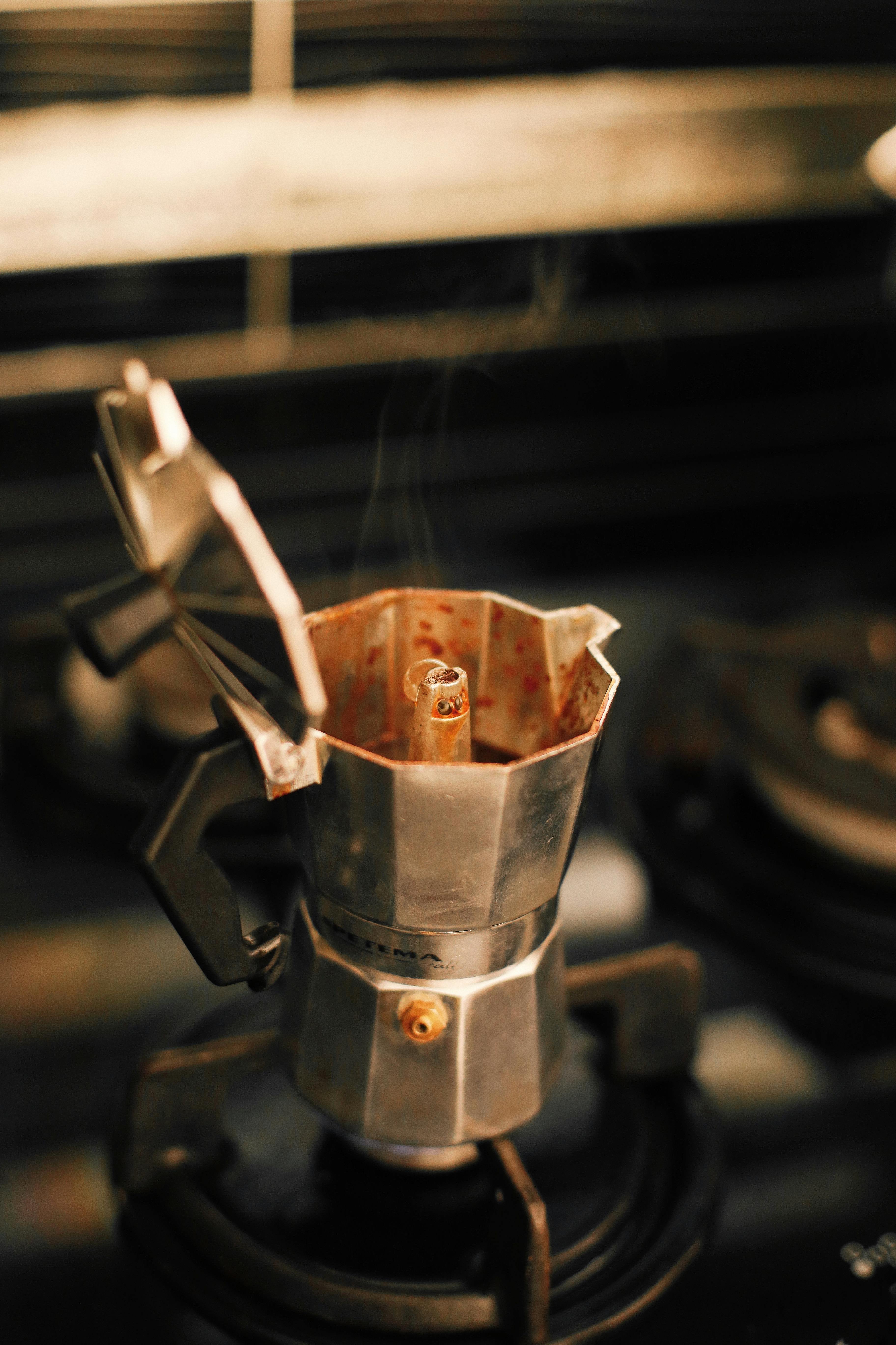 Moka Coffee Maker Pot On Gas Stove. Stock Photo, Picture and