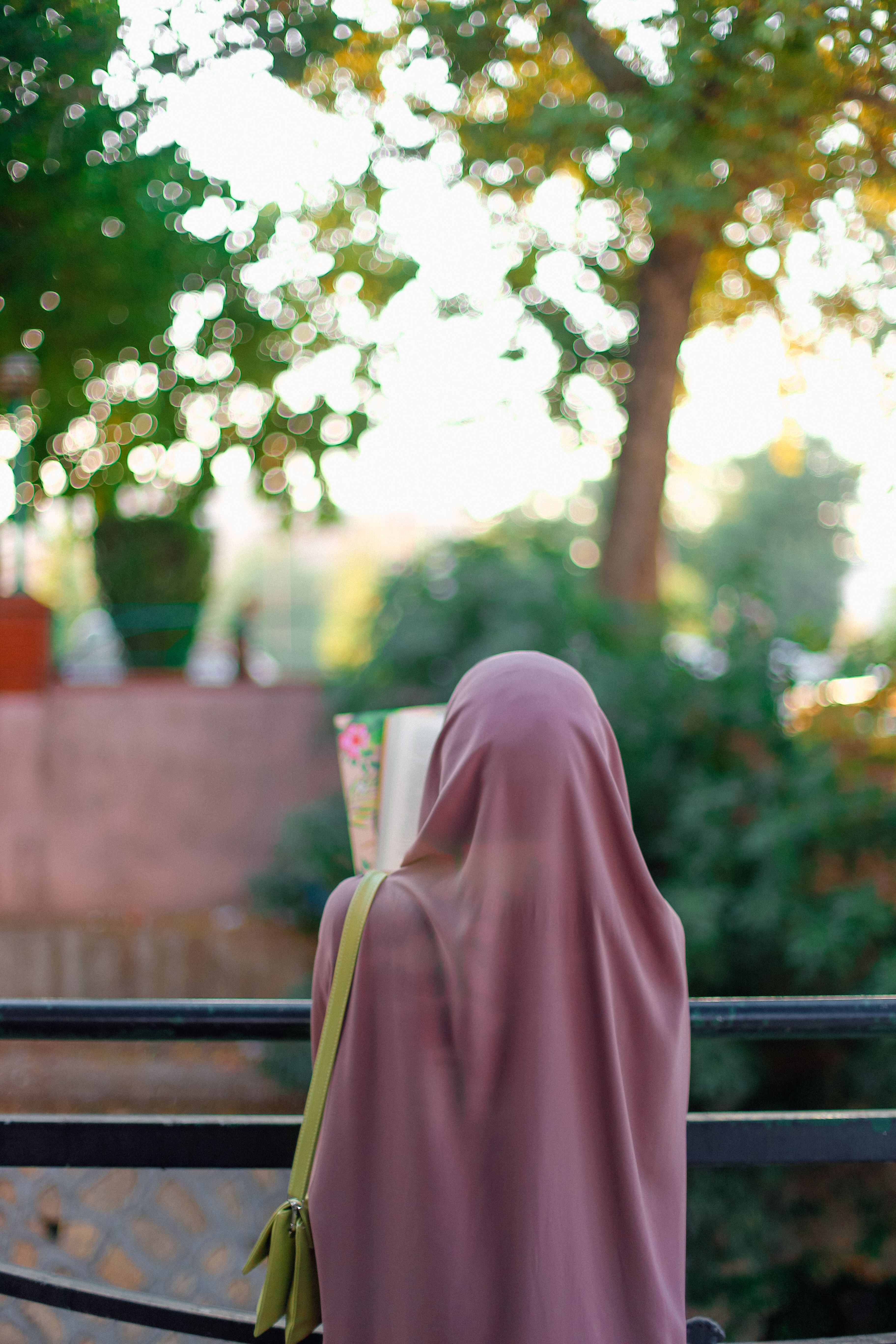 Woman in Brown Hijab Standing Near Brown Tree · Free Stock Photo