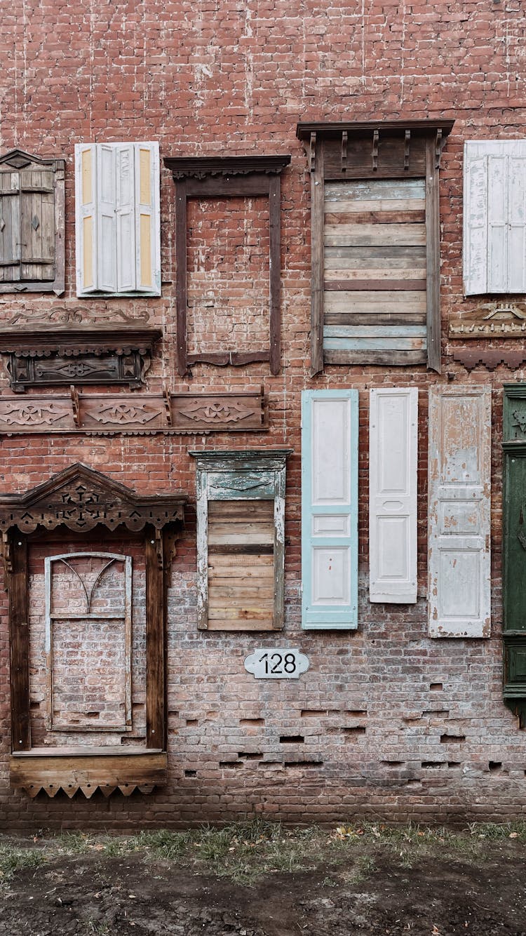 Wooden Frames And Shutters On A Brick Wall