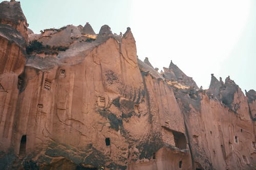 Brown Rocky Mountain Under White Sky