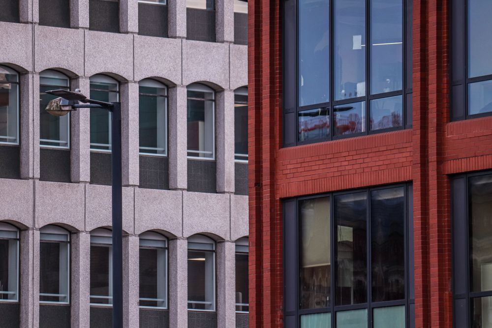 Red brick and stone facades on a city street — photo by Boys in Bristol Photography on Pexels