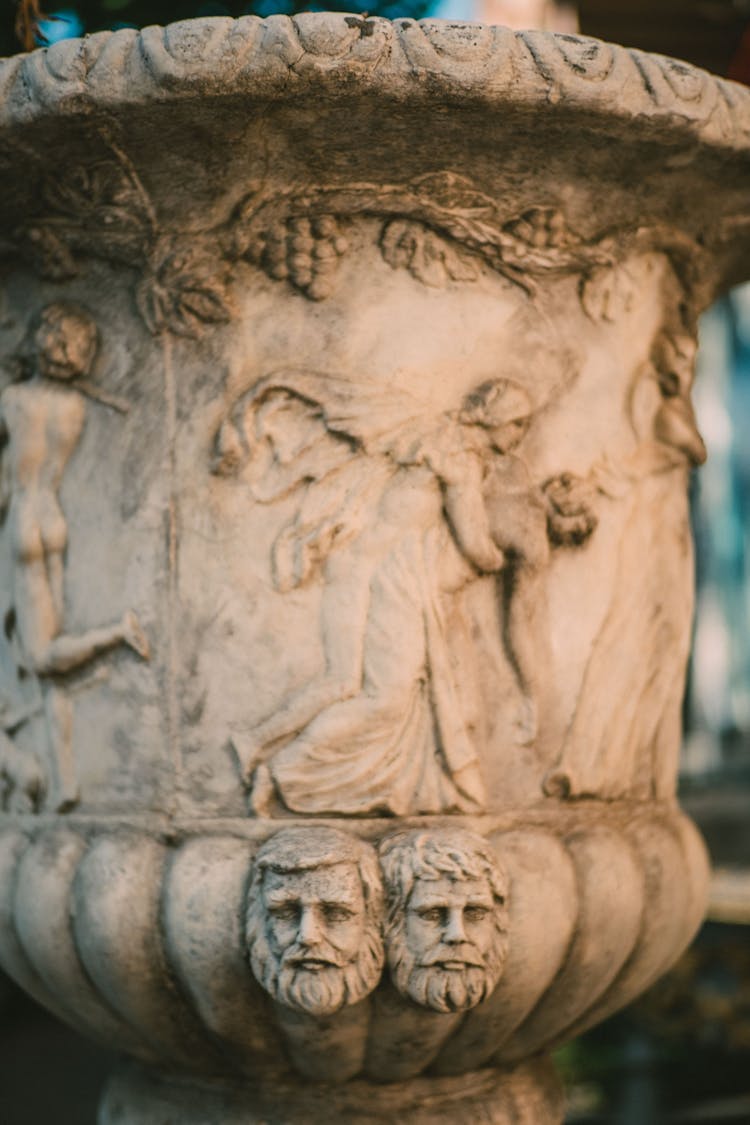 Stone Urn With Bas Relief