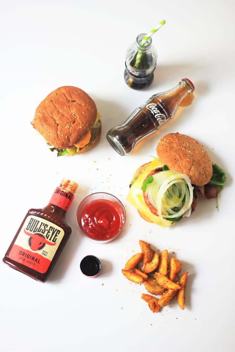 Burgers And Fries On White Table