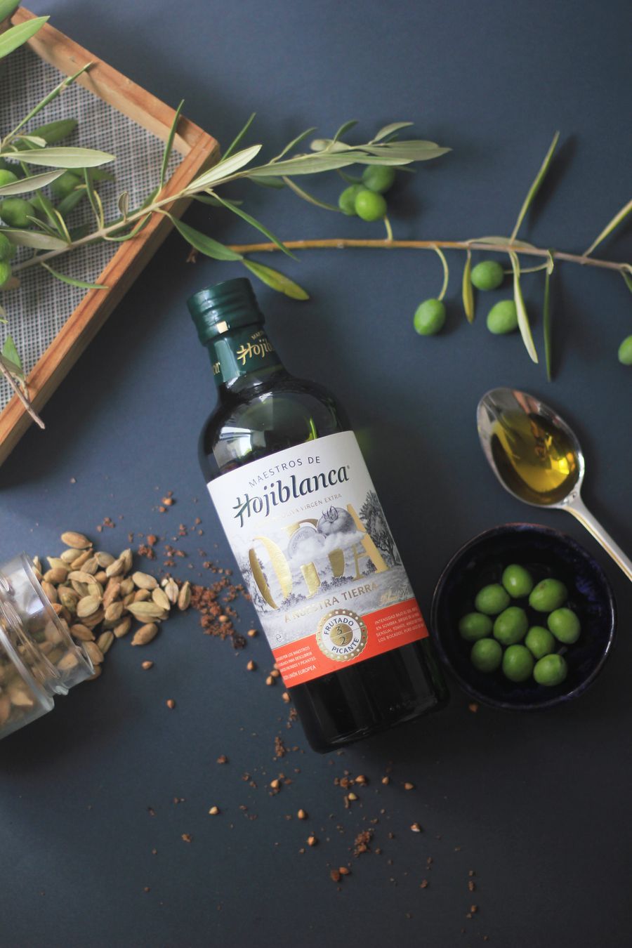 A bottle of extra virgin olive oil with herbs
