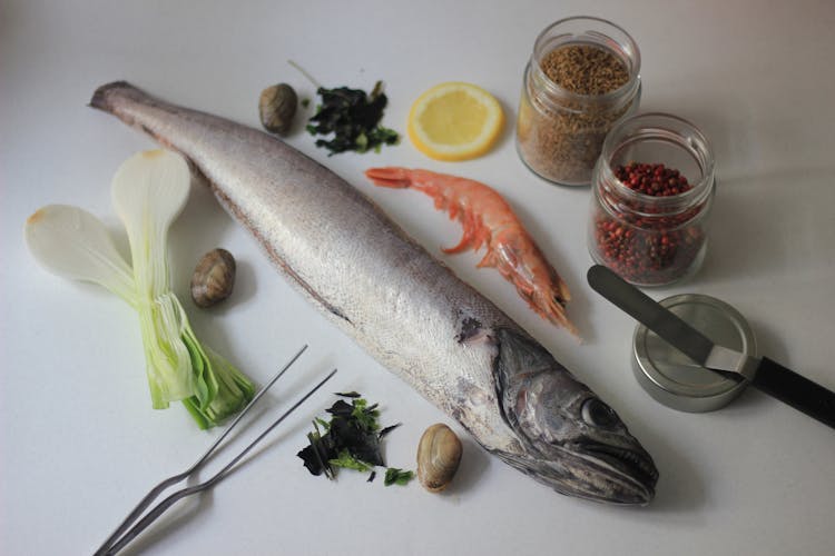 Photograph Of A Raw Fish Beside A Shrimp