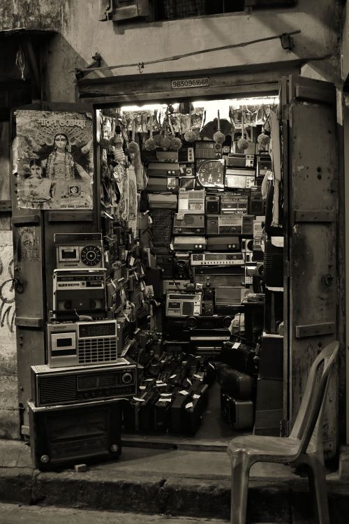 Free Explore an antique shop filled with vintage radios and electronics for a nostalgic trip. Stock Photo