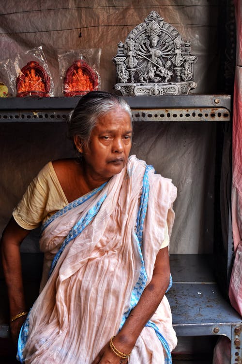 Photo of an Elderly Woman Sitting
