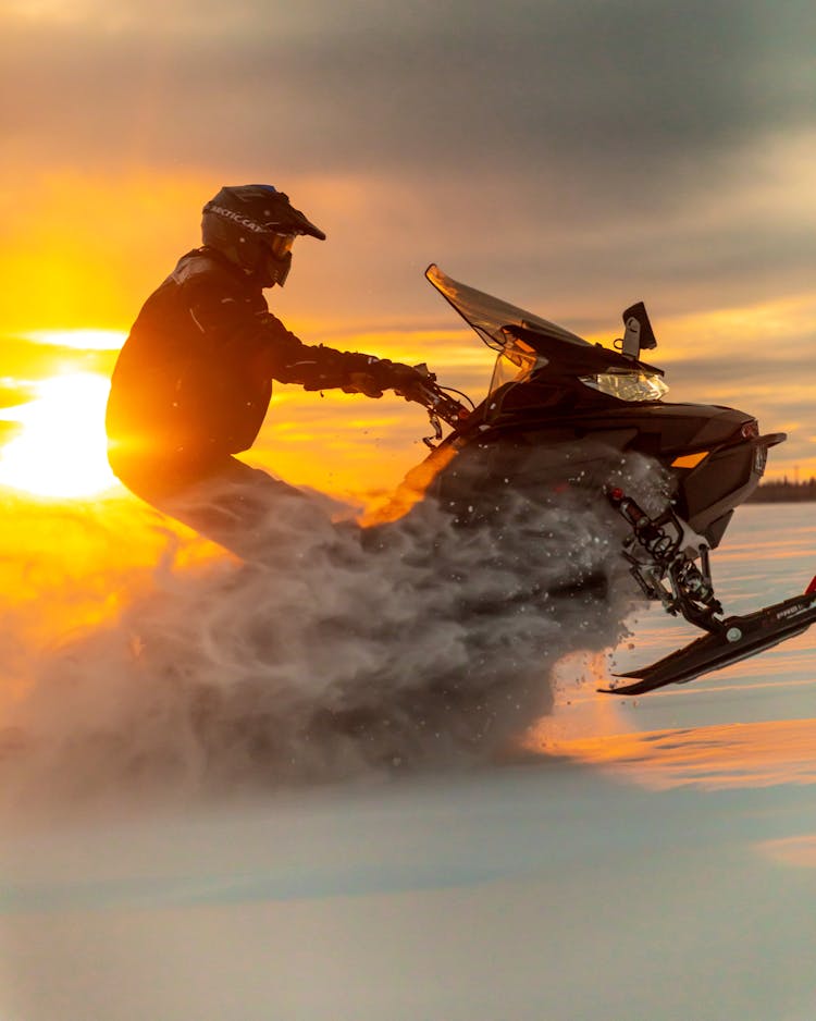 Man Riding Snowmobile