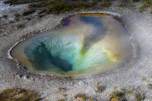 Free Aerial view of a colorful geothermal hot spring in Yellowstone National Park. Stock Photo