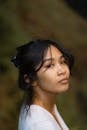 Young Asian woman looking with pride