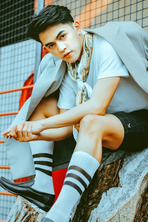 Photo of a Man Wearing White and Black Socks