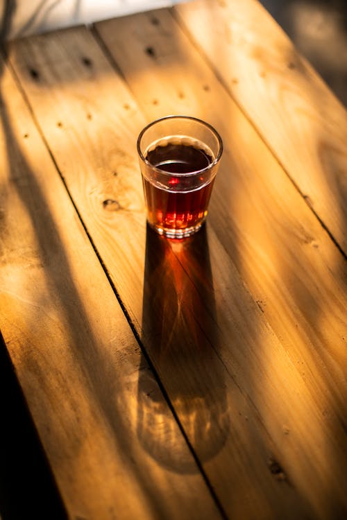 Free Tea on a Glass on Top of Wooden Table Top  Stock Photo