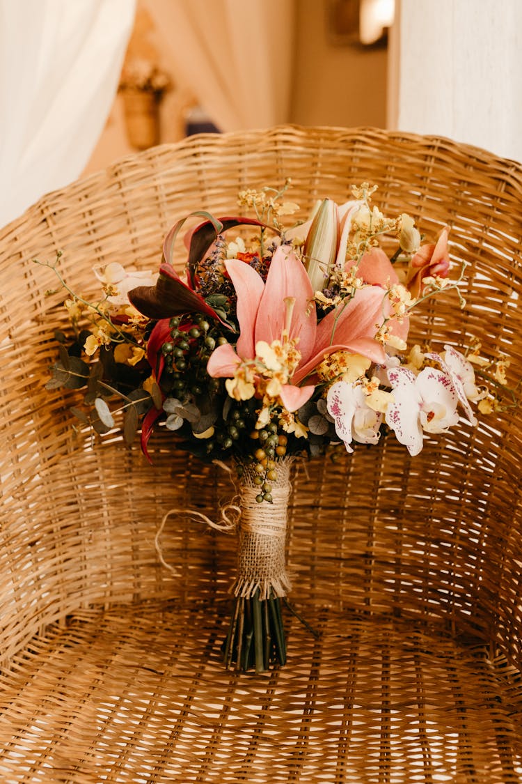  Bouquet Of Fresh And Dry Flowers And Fruits On Wicker Chair