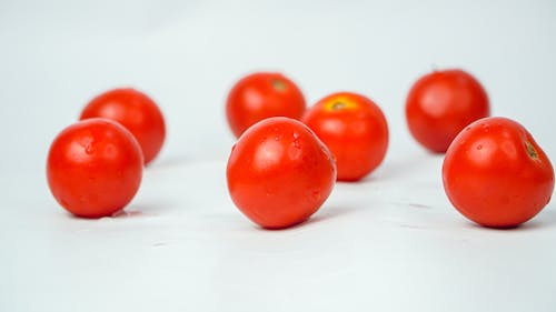 Red Cherry Tomatoes on White Surface