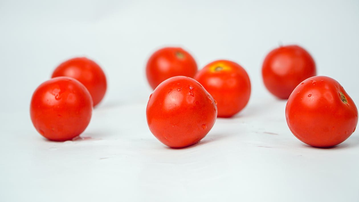 Free Red Cherry Tomatoes on White Surface Stock Photo