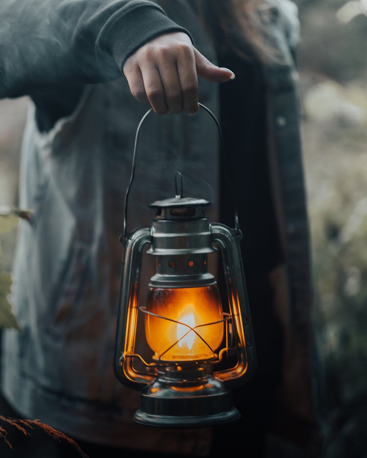 Close Up View Of Woman Holding Lantern