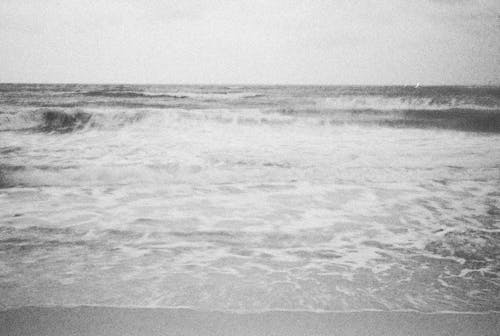 Black and White Photograph of Waves on the Sea