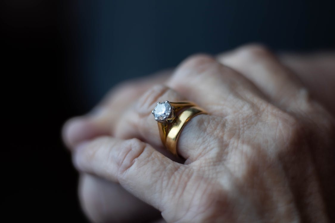 Free Close Up Shot of Rings on Person's Finger Stock Photo