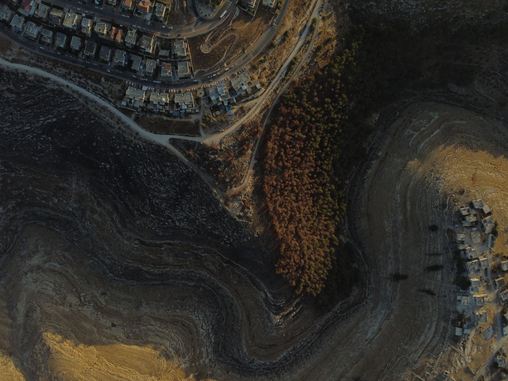 Stunning aerial view capturing residential and rugged natural landscape in Tekoa.