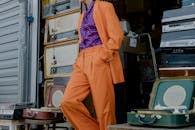A Person in Orange Suit Standing in a Store