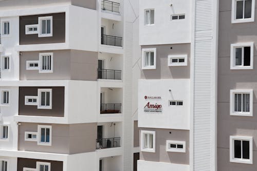 White Concrete Apartments with Balconies