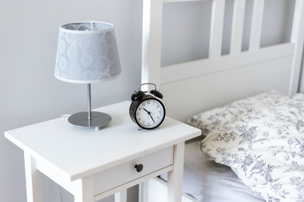 Tiny bedroom surfaces holding only the daily essentials.