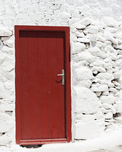 Безкоштовне стокове фото на тему «антикварні двері, архітектура, білий кам'яною стіною»