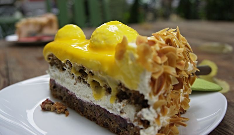 Slice of lemon curd layer cake showing soft sponge and creamy filling