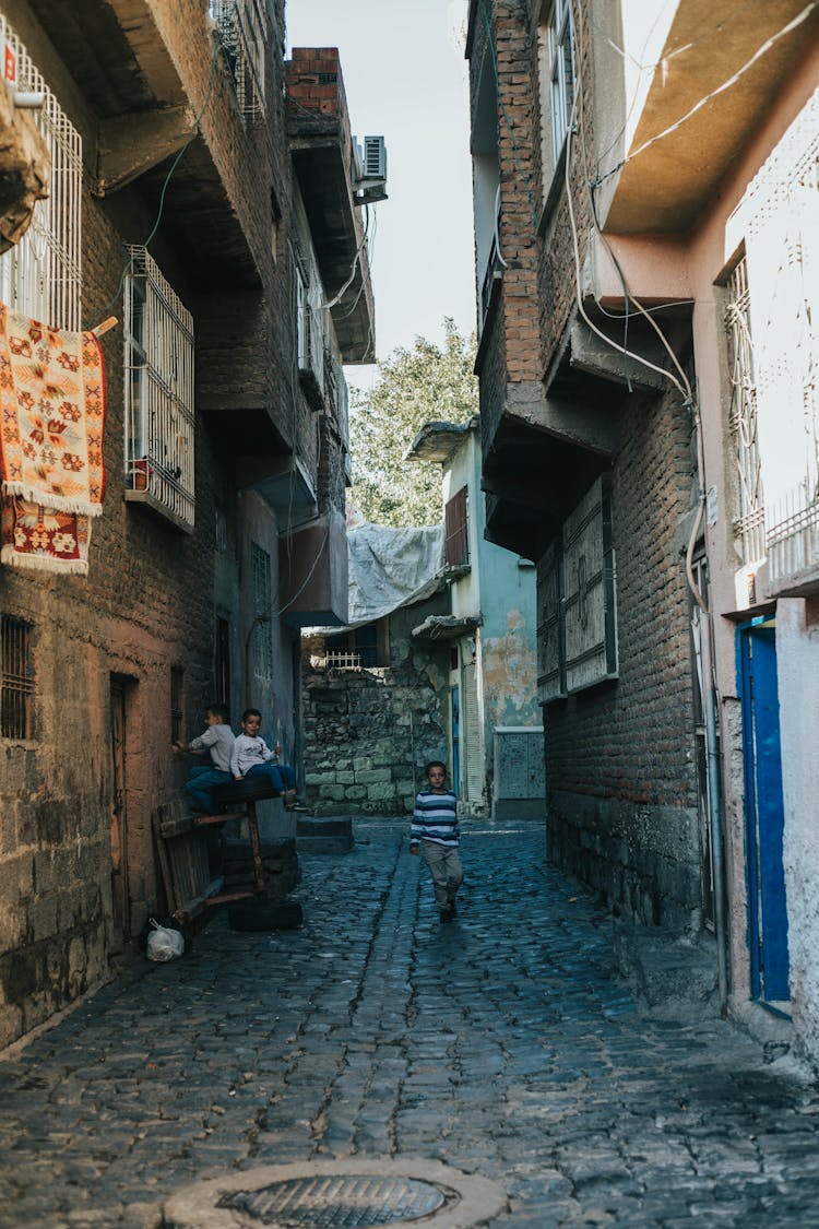 People Walking On The Alleyway