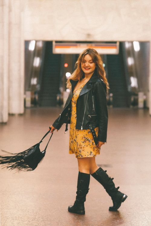 A Woman in Yellow Dress and Black Leather Jacket Dancing Free Stock Photo A Woman in Yellow Dress and Black Leather Jacket Dancing Free Stock Photo