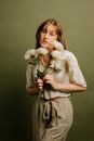 Young woman holding flowers 