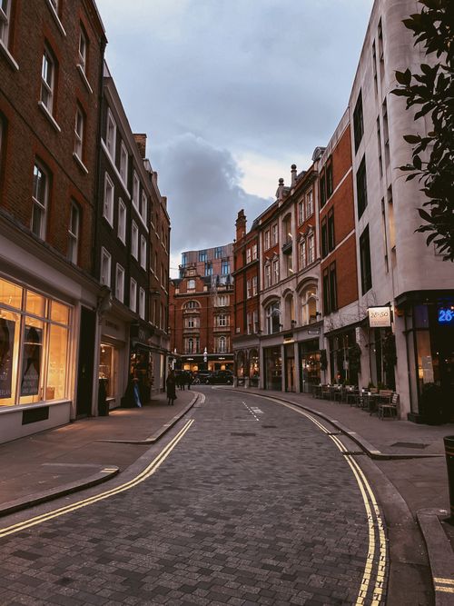 Free A picturesque urban street with charming historic architecture, perfect for travel enthusiasts. Stock Photo